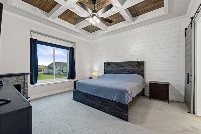227 SW Eagles Ridge Dr, Blue Springs, MO 64014 - bedroom with a barn door, coffered ceiling, light colored carpet, a wooden ceiling with exposed beams, and a ceiling fan