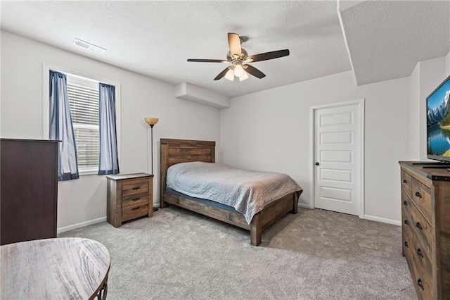 227 SW Eagles Ridge Dr, Blue Springs, MO 64014 - bedroom featuring carpet floors, a textured ceiling, and a ceiling fan