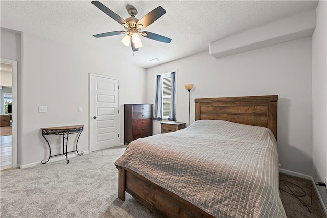 227 SW Eagles Ridge Dr, Blue Springs, MO 64014 - bedroom featuring carpet floors, multiple windows, ceiling fan, and a textured ceiling