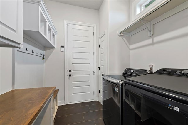227 SW Eagles Ridge Dr, Blue Springs, MO 64014 - laundry room with dark tile patterned flooring and washing machine and clothes dryer