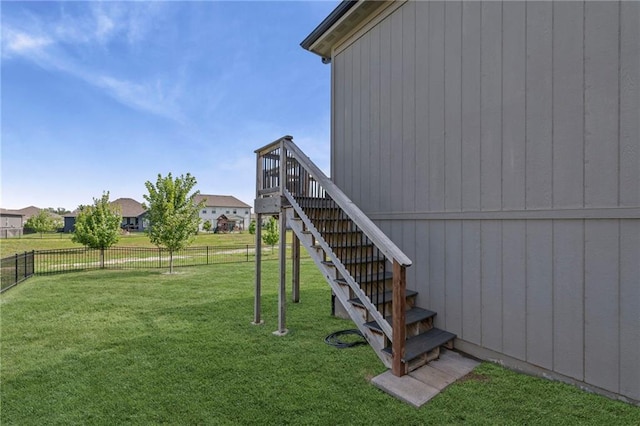227 SW Eagles Ridge Dr, Blue Springs, MO 64014 - fenced backyard featuring stairway and a wooden deck