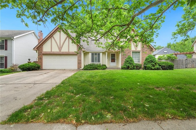 10432 Bond St, Overland Park, KS 66214 - tudor-style house with a garage, driveway, brick siding, and stucco siding