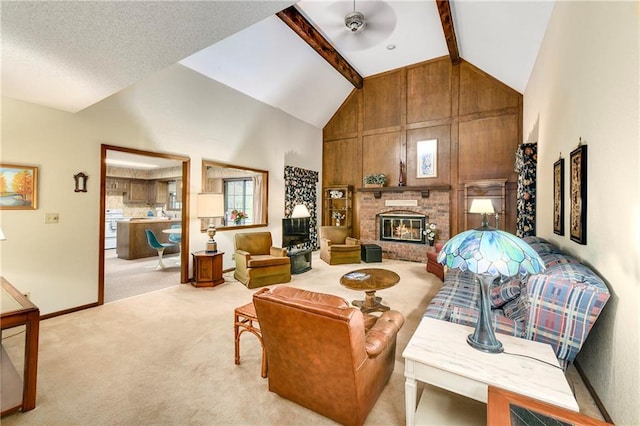 10432 Bond St, Overland Park, KS 66214 - living room featuring light colored carpet, high vaulted ceiling, a brick fireplace, and beamed ceiling