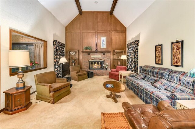 10432 Bond St, Overland Park, KS 66214 - carpeted living room featuring beam ceiling, a fireplace, and high vaulted ceiling
