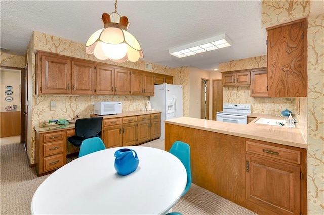 10432 Bond St, Overland Park, KS 66214 - kitchen featuring white appliances, light carpet, a textured ceiling, a peninsula, and light countertops