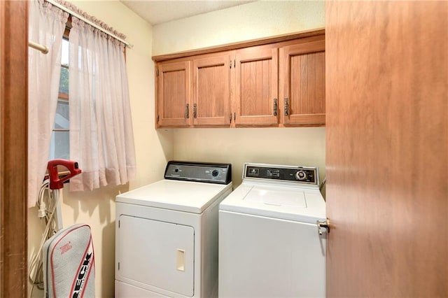 10432 Bond St, Overland Park, KS 66214 - washroom with cabinet space and washer and clothes dryer
