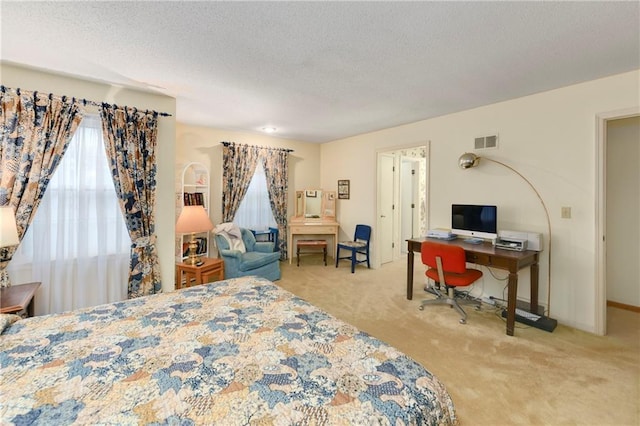 10432 Bond St, Overland Park, KS 66214 - bedroom with carpet floors, a textured ceiling, and a desk