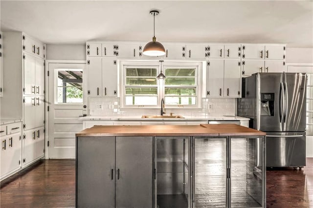 1480 E 76th Ter, Kansas City, MO 64131 - kitchen featuring stainless steel fridge, wood counters, and dark wood finished floors