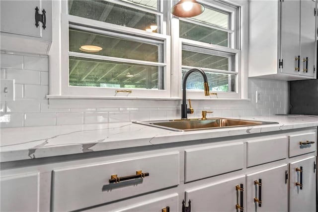 1480 E 76th Ter, Kansas City, MO 64131 - kitchen with backsplash and light stone countertops