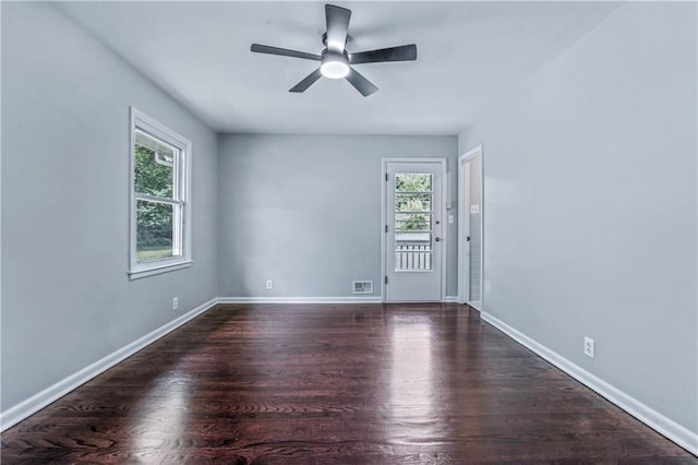 1480 E 76th Ter, Kansas City, MO 64131 - unfurnished room featuring wood finished floors and ceiling fan