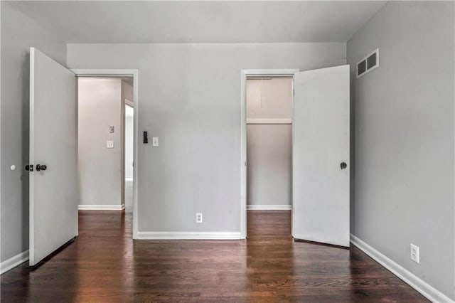 1480 E 76th Ter, Kansas City, MO 64131 - unfurnished bedroom featuring wood finished floors and a closet