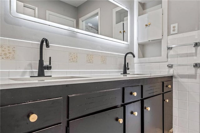 1480 E 76th Ter, Kansas City, MO 64131 - bathroom featuring double vanity, backsplash, and tile walls
