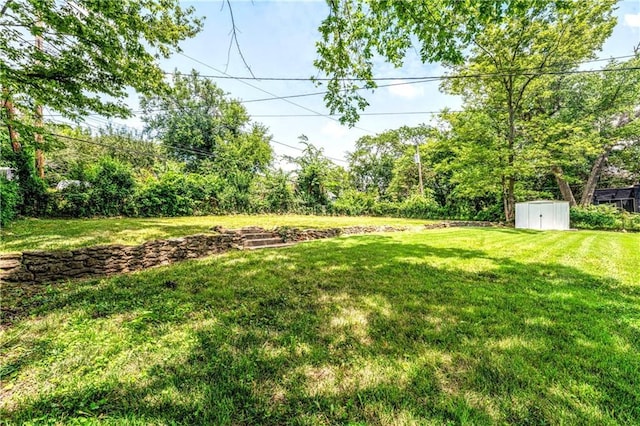 1480 E 76th Ter, Kansas City, MO 64131 - view of green lawn with a storage unit
