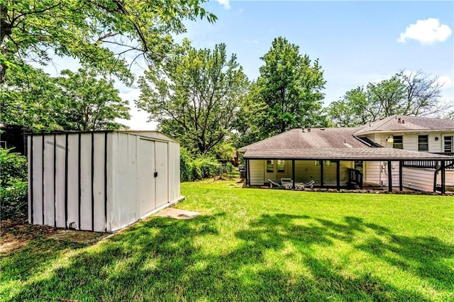 1480 E 76th Ter, Kansas City, MO 64131 - view of green lawn featuring a shed
