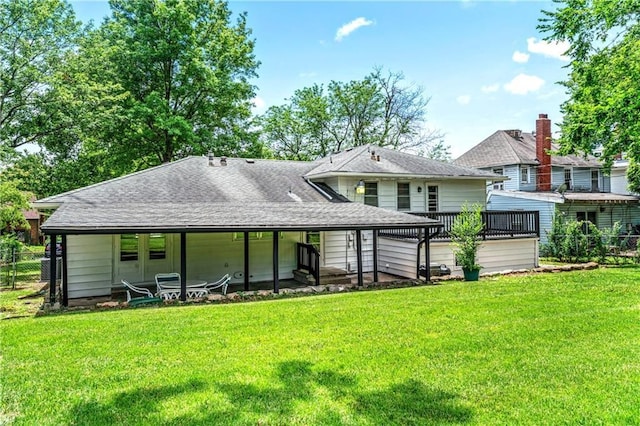 1480 E 76th Ter, Kansas City, MO 64131 - back of property with a shingled roof