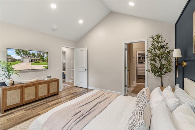 521 E Bird St, Hamilton, MO 64644 - bedroom with wood finished floors, high vaulted ceiling, and recessed lighting
