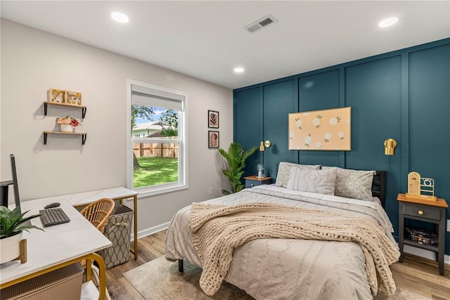 521 E Bird St, Hamilton, MO 64644 - bedroom featuring recessed lighting, wood finished floors, and a desk