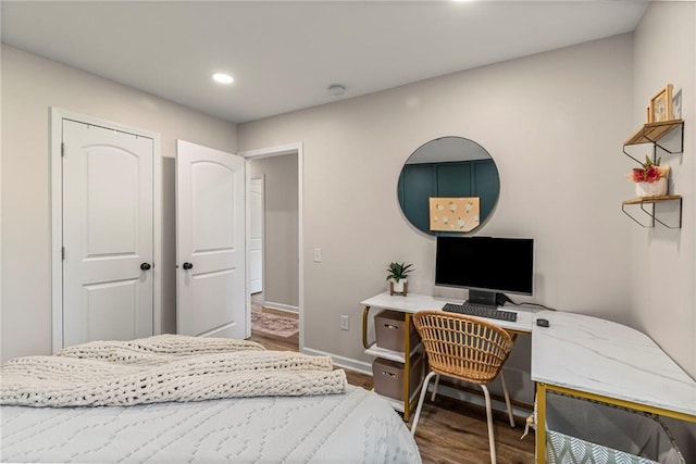 521 E Bird St, Hamilton, MO 64644 - bedroom with wood finished floors, recessed lighting, and an office area