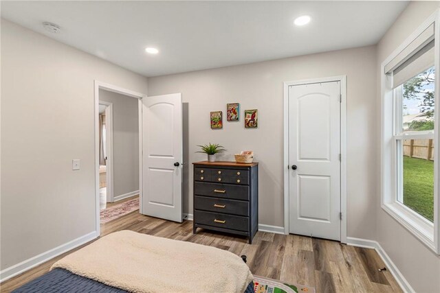 521 E Bird St, Hamilton, MO 64644 - bedroom featuring wood finished floors and recessed lighting