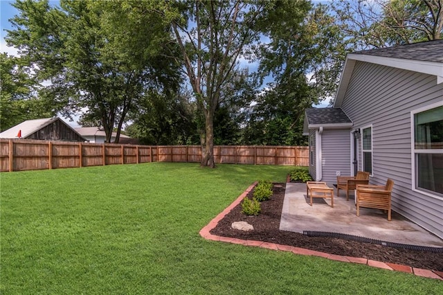 521 E Bird St, Hamilton, MO 64644 - fenced backyard with a patio area and an outdoor hangout area