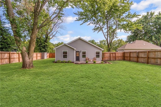 521 E Bird St, Hamilton, MO 64644 - rear view of house with a fenced backyard