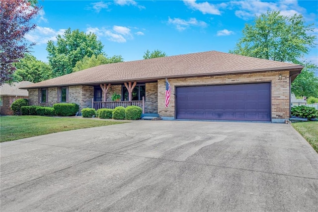705 Ozark Short Line, Odessa, MO 64076 - single story home with brick siding, a front yard, an attached garage, asphalt driveway, and covered porch