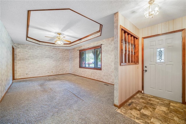 705 Ozark Short Line, Odessa, MO 64076 - foyer entrance featuring wallpapered walls, a textured ceiling, carpet, and ceiling fan