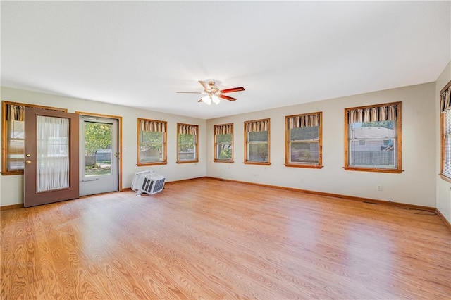 705 Ozark Short Line, Odessa, MO 64076 - spare room with light wood-style flooring, ceiling fan, and an AC wall unit