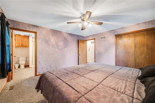 705 Ozark Short Line, Odessa, MO 64076 - carpeted bedroom with a closet, a ceiling fan, a textured ceiling, and connected bathroom