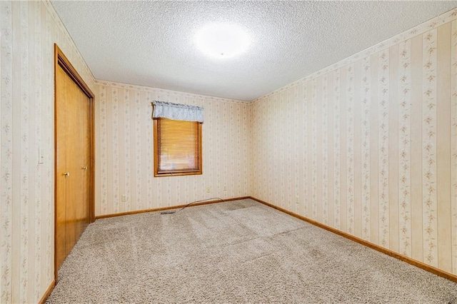 705 Ozark Short Line, Odessa, MO 64076 - unfurnished bedroom featuring a textured ceiling, carpet, and a closet