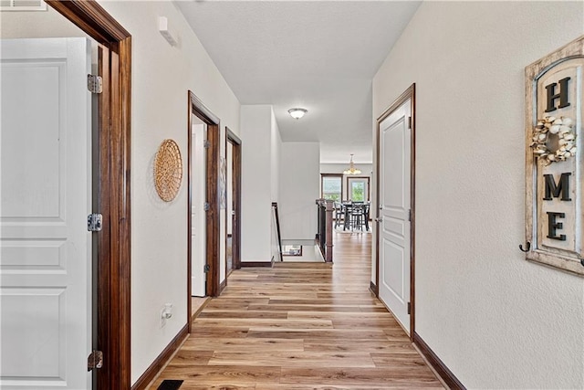 1658 Davis Cir, Eudora, KS 66025 - corridor with light wood-style flooring and an upstairs landing