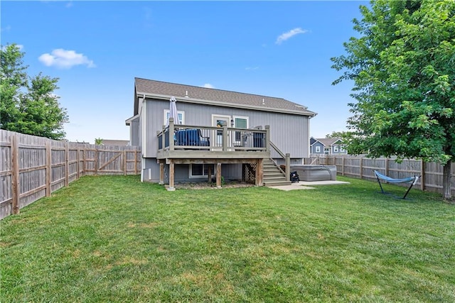 1658 Davis Cir, Eudora, KS 66025 - back of property with a hot tub, a fenced backyard, and a wooden deck