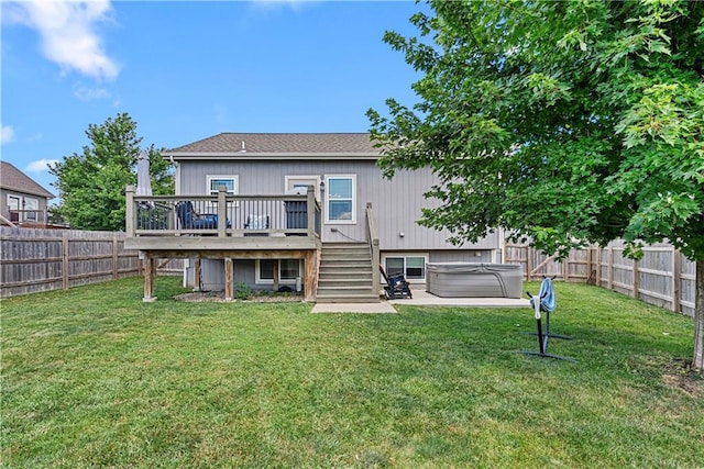 1658 Davis Cir, Eudora, KS 66025 - back of property featuring a hot tub, a deck, a fenced backyard, and stairway