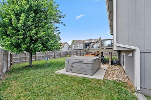 1658 Davis Cir, Eudora, KS 66025 - fenced backyard with a hot tub and stairway