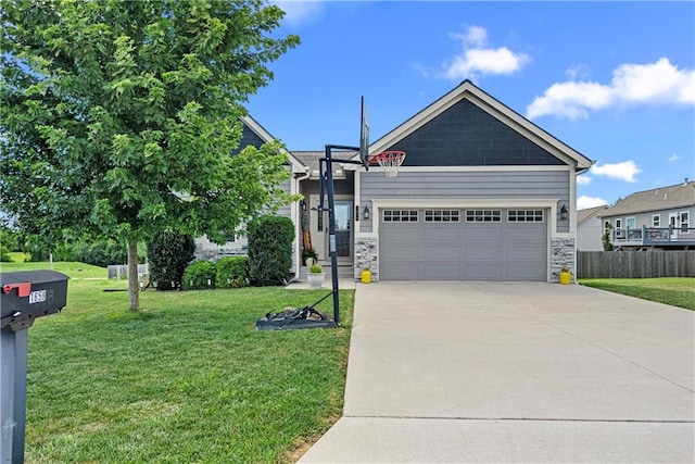 1658 Davis Cir, Eudora, KS 66025 - view of front of house with a garage, concrete driveway, and stone siding
