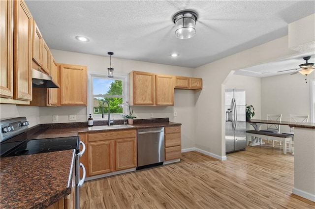 1004 SW Twilight Ln, Blue Springs, MO 64015 - kitchen featuring stainless steel appliances, under cabinet range hood, light wood-style flooring, ceiling fan, and a textured ceiling