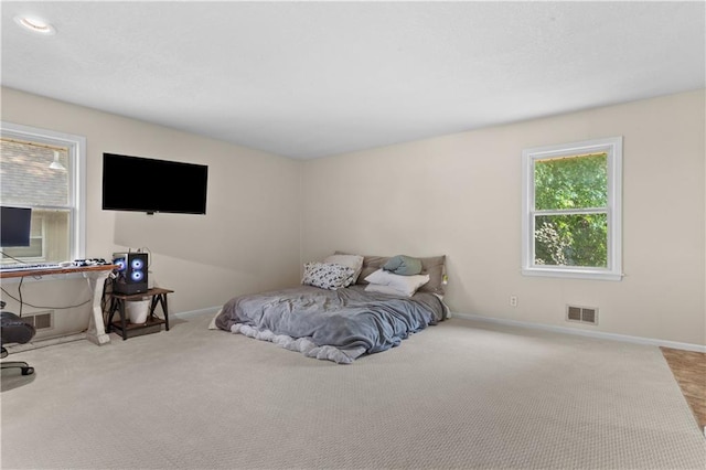1004 SW Twilight Ln, Blue Springs, MO 64015 - carpeted bedroom featuring baseboards
