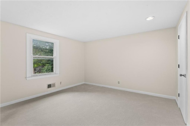 1004 SW Twilight Ln, Blue Springs, MO 64015 - spare room featuring light colored carpet and recessed lighting