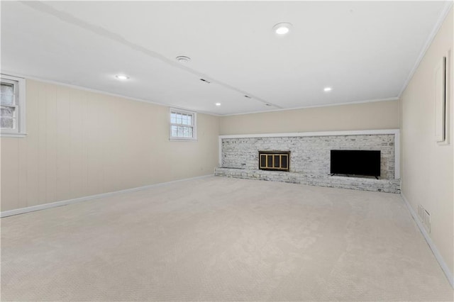 1004 SW Twilight Ln, Blue Springs, MO 64015 - below grade area featuring a brick fireplace, carpet floors, recessed lighting, and crown molding