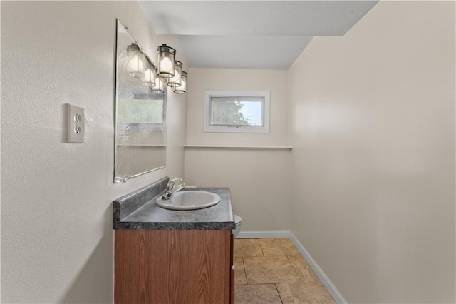 1004 SW Twilight Ln, Blue Springs, MO 64015 - bathroom featuring vanity, a chandelier, and tile patterned flooring