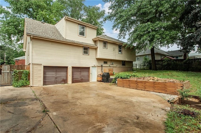 1004 SW Twilight Ln, Blue Springs, MO 64015 - view of front of house with concrete driveway, an attached garage, and a shingled roof