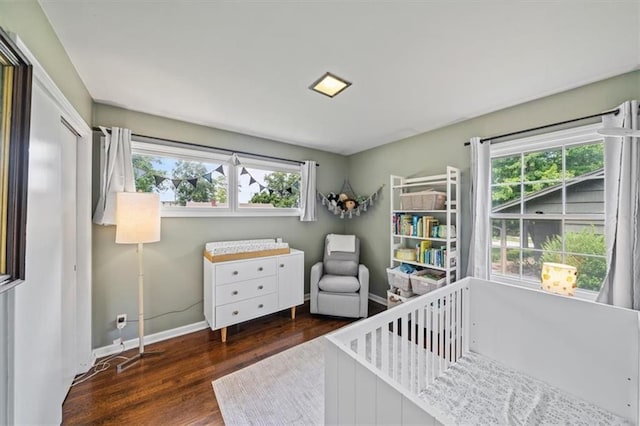 4717 W 76th St, Prairie Village, KS 66208 - bedroom with wood finished floors and a crib