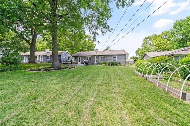 4717 W 76th St, Prairie Village, KS 66208 - view of green lawn with a vegetable garden