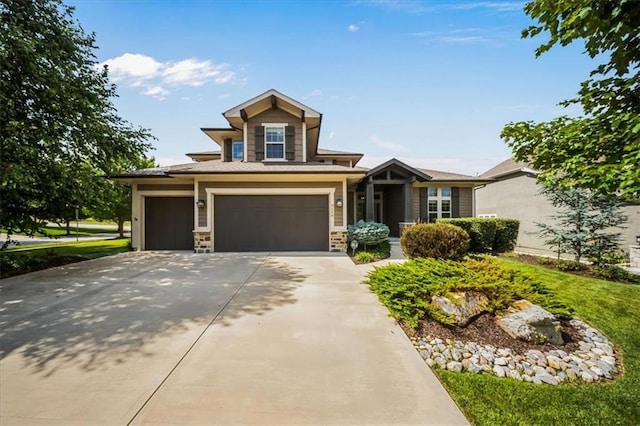 9158 W 178th Ter, Overland Park, KS 66013 - view of front of property featuring driveway, stone siding, and a garage