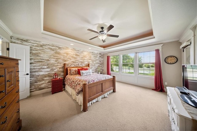 9158 W 178th Ter, Overland Park, KS 66013 - carpeted bedroom with a raised ceiling, ornamental molding, an accent wall, and a ceiling fan
