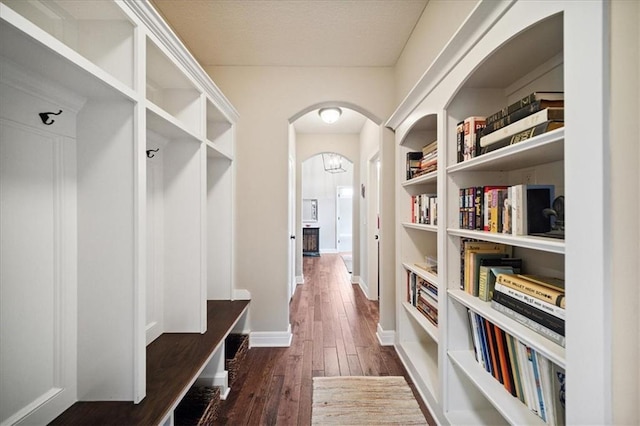 9158 W 178th Ter, Overland Park, KS 66013 - mudroom with arched walkways and dark wood-type flooring