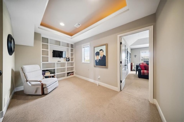 9158 W 178th Ter, Overland Park, KS 66013 - sitting room featuring a raised ceiling, carpet, built in shelves, and ornamental molding