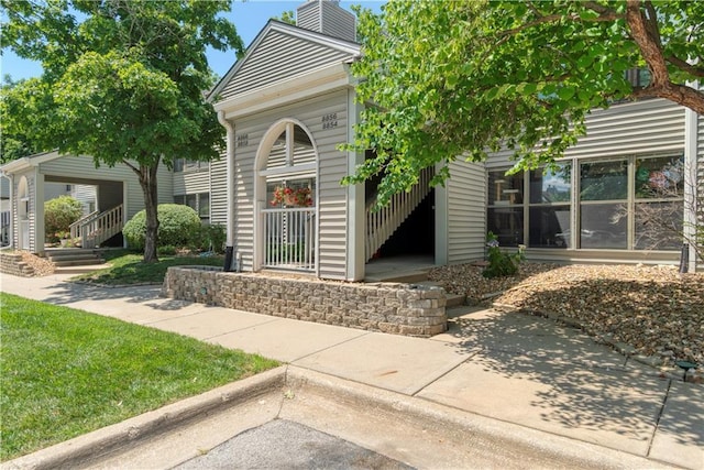 8858 W 106th Ter, Overland Park, KS 66212 - doorway to property with a chimney