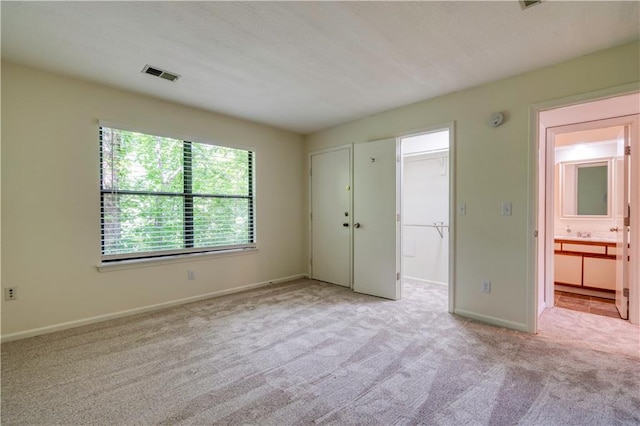 8858 W 106th Ter, Overland Park, KS 66212 - unfurnished bedroom with carpet floors and a walk in closet