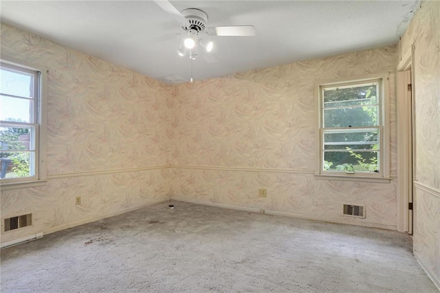 619 E 109th Ter, Kansas City, MO 64131 - empty room featuring ceiling fan, carpet floors, and wallpapered walls